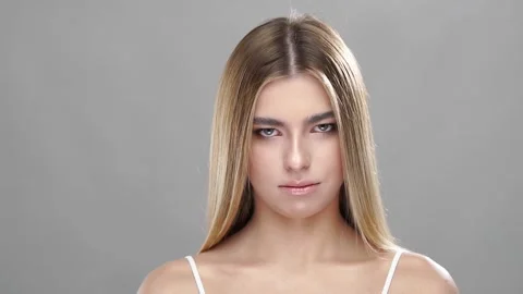 Angry model looking to camera with water splashes around Stock Footage 146595904