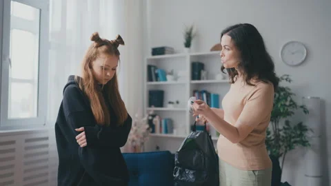 Angry mother finding marijuana in her daughter's backpack, rebellious phase Stock Footage 241786414