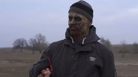 An angry mutamt monster Throws up big machete and spinning it in Wasteland Stock Footage 102053190