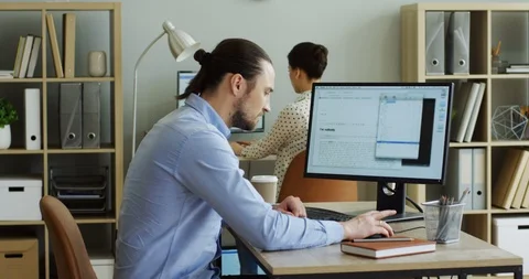 Angry nervous man working at the computer in the office and leaving his Stock-Footage 91602647