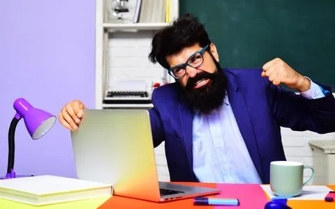 Angry office worker having problem with technology. Enraged bearded busines.. 写真素材