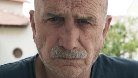Angry old man portrait. Elderly man's close up face portrait Video stock 132878543