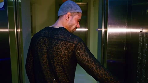 Angry person stands pressing wrong buttons of elevator Stock Footage 300363032