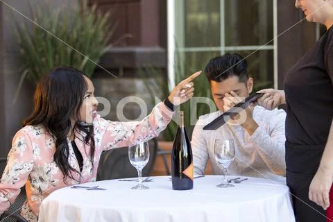 Angry Restaurant Customer Complaining to Waitress Stock Photos