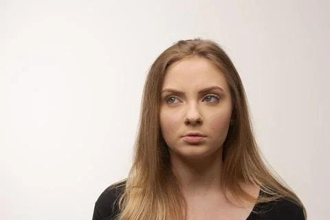 Angry sad young woman portrait in studio white background Stock Photos