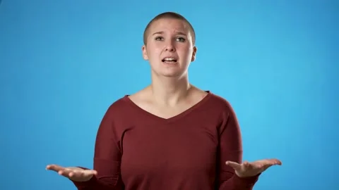 Angry, scared gender fluid non binary young woman 20s put hands on head Stock Footage 223261497