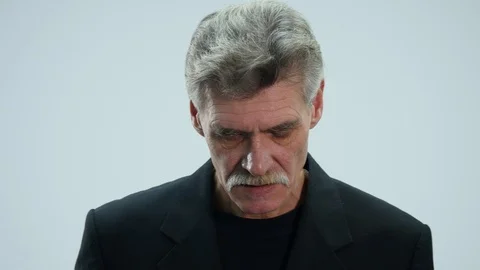 Angry senior man speaking on mobile phone Stock Footage 86559045