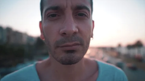 Angry, serious handsome guy on bridge with sunlight.  Stock Footage 112894553