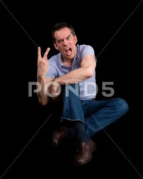 Angry shouting man giving two finger gesture Stock Photos