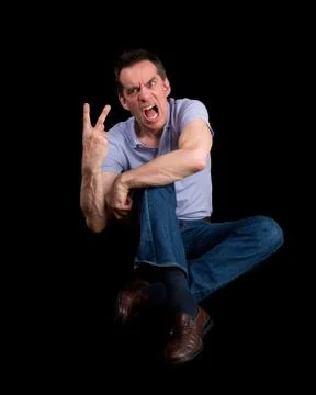 Angry shouting man giving two finger gesture Stock-Fotos