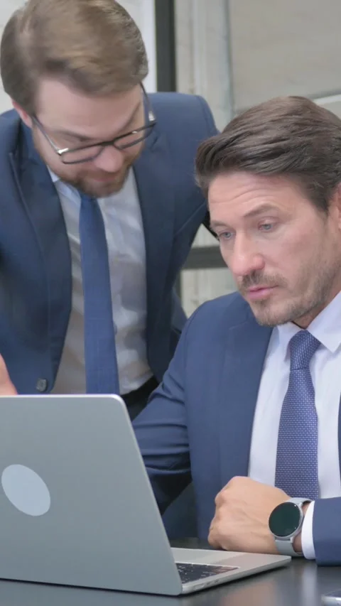 Angry Standing Businessman in Argument with Partner at Work, Using Laptop Stock Footage 321108125