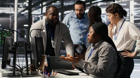 Angry technicians in server room fighting after encountering critical error Stock Photos