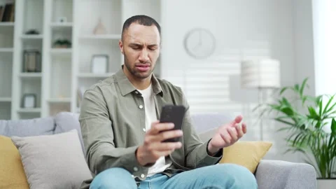 Angry unhappy man user because of phone failure problems, spam, non-working app, Stock Footage 247072826