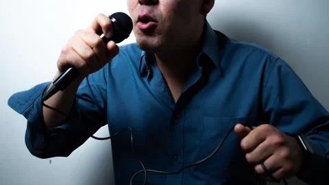 Angry Unrecognizable Man Talking Into Microphone, Close-Up Portrait. 動画素材 335967076