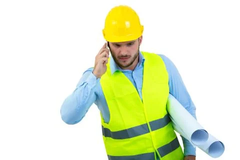 Angry upset young construction engineer yeling at the phone Stock Photos