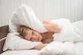 The angry woman lay on the bed Photo