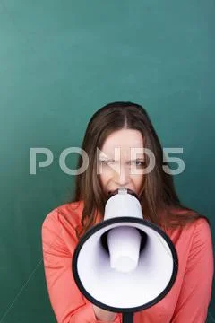 Angry woman with a megaphone Stock Photos