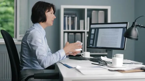 Angry woman working with documents Stock Footage 156765763