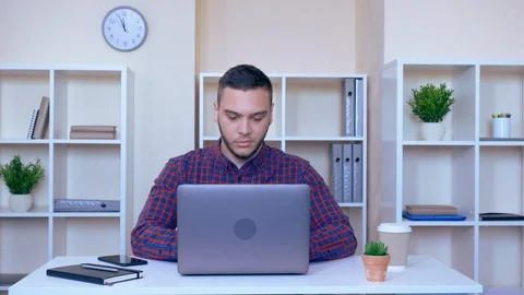 Angry worker typing on laptop Stock Footage 112079742