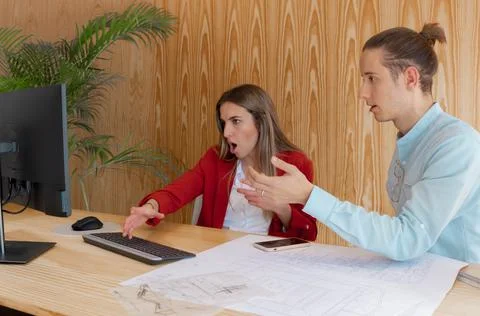 Angry workers arguing over different ideas with angry gesture Stockfoto's