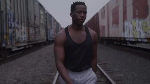 Angry Young Guy Walks On Train Tracks Stock Footage 270326914