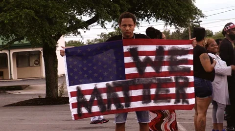 Angry young man black lives defaced American flag Stock Footage