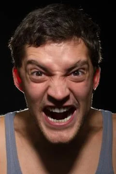 Angry young man shouting. Stock Photos