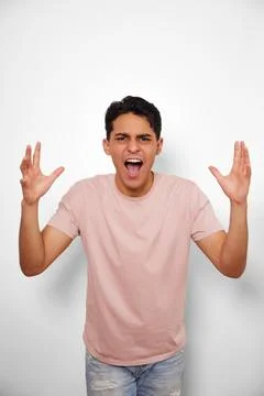 Angry young man on white background Stock Photos