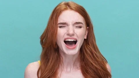 Angry young woman screaming isolated Stock Footage