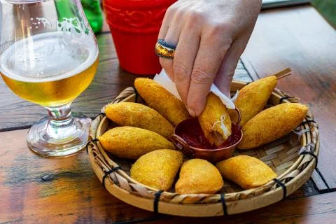 Angu pastry, with free-range chicken filling and now pro-nobs. Accompanying p Stock Photos