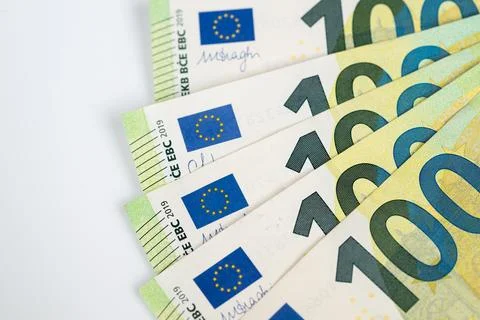 Angular arrangement of euro banknotes, sharp focus on denomination numbers, s Stock Photos