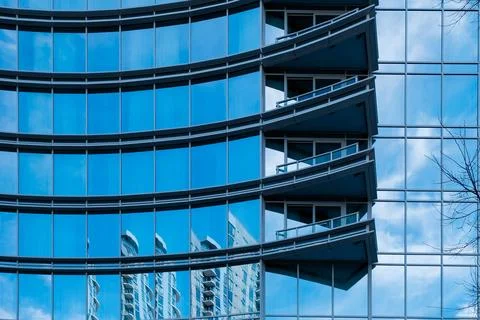 Angular balconies and mirrored windows on high rise in Charlotte, North Car.. Stock Photos