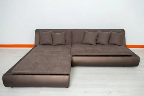 Angular brown leather sofa on a white background Stock Photos