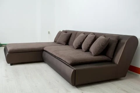 Angular brown leather sofa on a white background Stock Photos