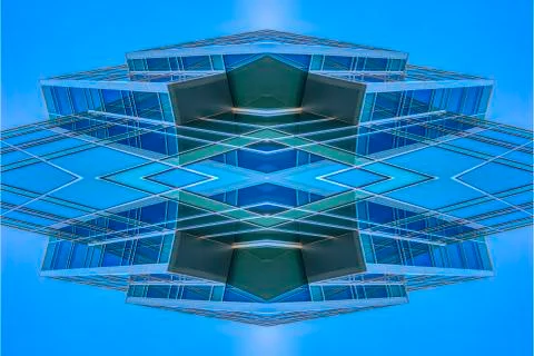 Angular building looking abstract with sky reflect Foto stock