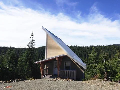 Angular Building On A Mountain Surrounded by Trees Stock Photos