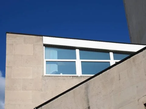  angular close up view of an old 1960s concrete brutalist stye building wi... Stock Photos