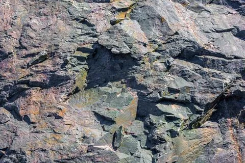 Angular fractured metamorphic rock, sharp edges, natural texture, outdoor Stock Photos