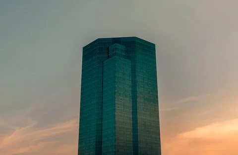Angular geometric mirror cladding on a modern building. Stock Photos