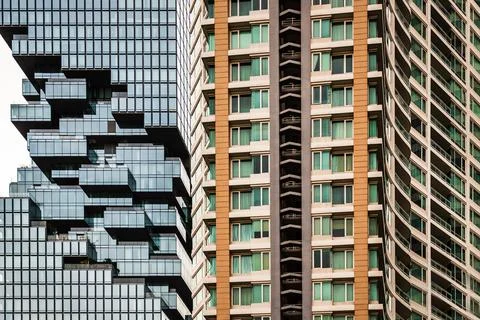 Angular geometric mirror cladding with repeating structure of modern architec Stock Photos