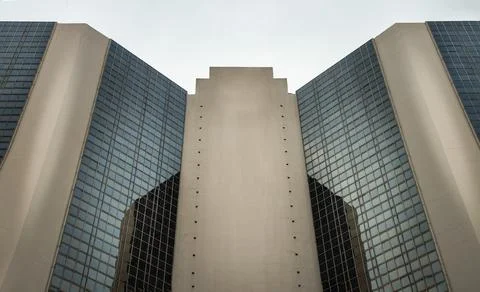 Angular geometric on a modern building with repeating structure and reflected Stock Photos