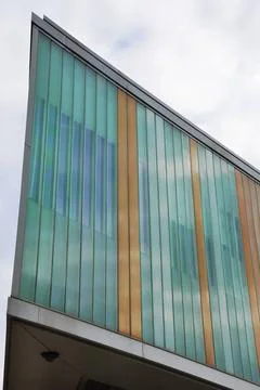 Angular glass building Angular modern building detail in blue and brown Co... Stock Photos