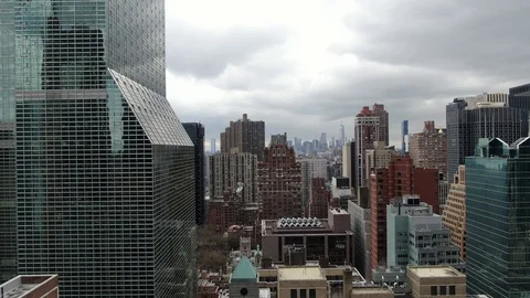 Angular Glass Tower Above Midtown East Under Heavy Cloud Vídeos de archivo 127470944