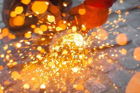 Angular grinding machine cuts metal with sparks 스톡 사진