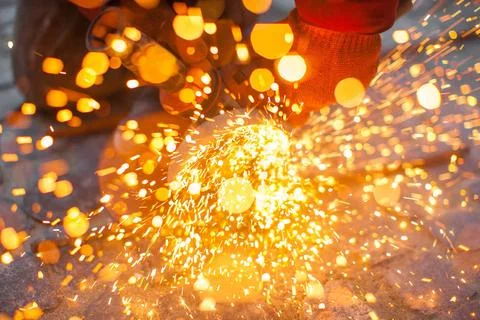Angular grinding machine cuts metal with sparks Angular grinding machine c... Stock Photos