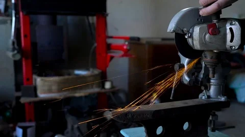 Angular grinding machine is cutting the metal Stock Footage 75936580