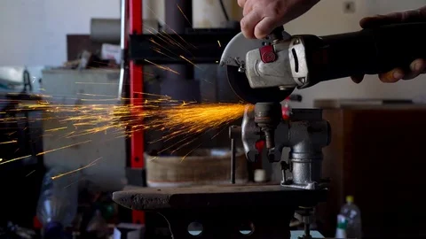 Angular grinding machine is cutting the metal Stock Footage 75936581