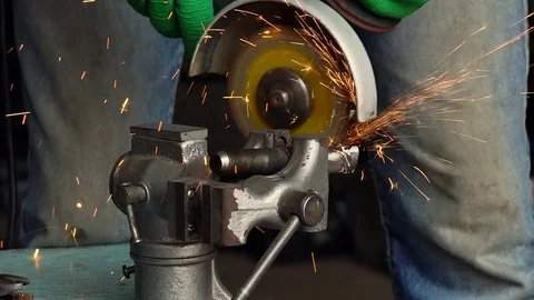 Angular grinding machine is cutting the metal Stock Footage 76986913