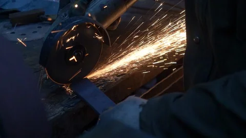 Angular grinding machine, sparks flying apart in the dark. Stock Footage 129547042