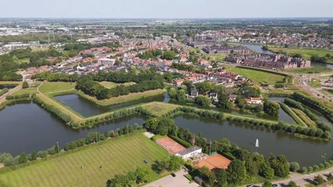 Angular moat lined fortifications green ramparts sports fields clustered red Vídeos de archivo 327946609